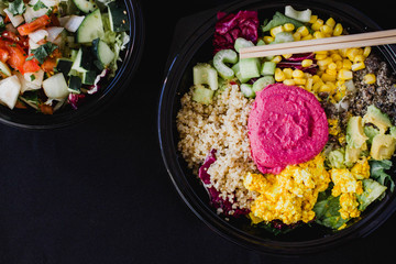 Poke bowl vegan detox salad with quinoa on a black background. Flat lay, top view, space for text