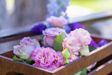 Bouquets of fresh flowers decoration of the festive table. Celebrating an open air party. Decor Details