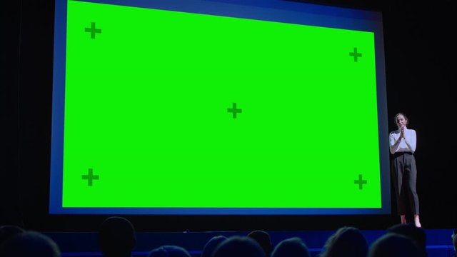 Business Conference Stage: Female Keynote Speaker Presents New Product to the Audience, Movie Theater Shows Green Screen, Mock-up, Chroma Key. Live Event on Health, Science and Technology