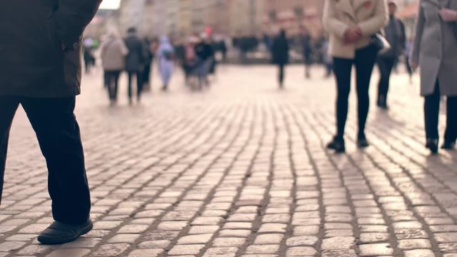 Unrecognizable people in the european city.