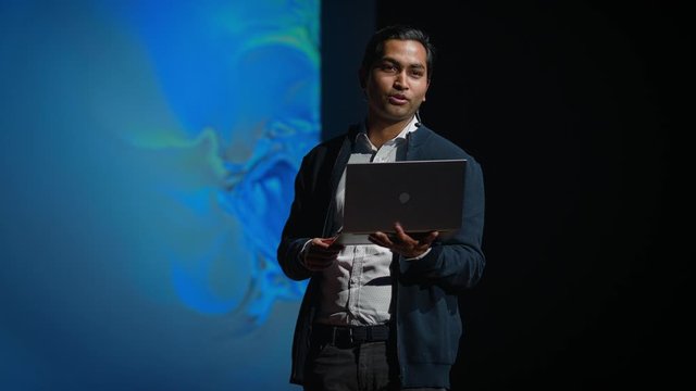 Business Conference Stage: Indian Tech Development Guru Presents Firm's Newest Product, He's Holding Laptop and Does Motivational Talk about Science, Technology, Software Development and Leadership