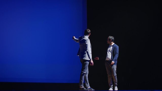 On Stage: Startup Hardware Engineer and Software Developer Present New Product. Expert Does Motivational Talk. Speaker does Lecture about Science, Technology, Entrepreneurship, Health, Leadership