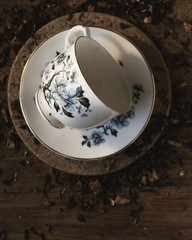 Tea cup and saucer with loose leaf tea