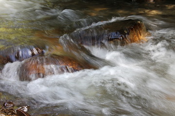 water flowing over rocks