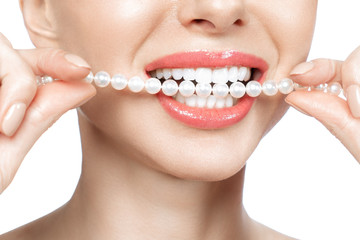 Beautiful female teeth smile and pearl necklace, Dental Health Concept Teeth whitening. Dental...