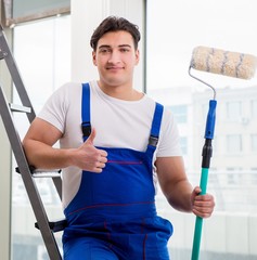 The painter repairman working at construction site