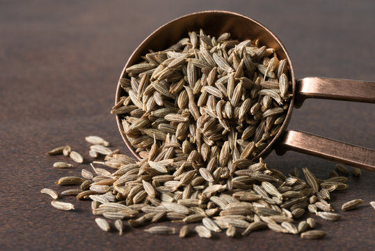 Cumin Seeds Spilled from a Teaspoon