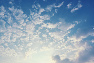 fluffy cloud above blue sky with sunlight in the morning