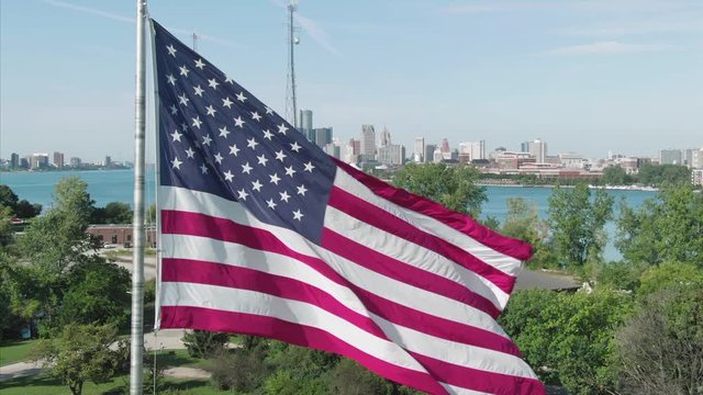 Aerial: American Flag on Belle Isle park in Detroit, USA