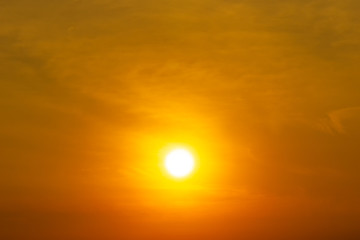 Fototapeta na wymiar Brightness sun and cloud on orange sky nature background