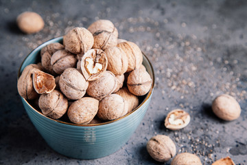 Walnuts in a bowl. Healthy food and snack.