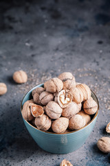 Walnuts in a bowl. Healthy food and snack.