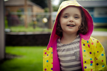 little girl with colorful coat
