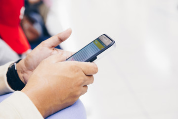 Business hand use smartphone in airport travel vacation close up on hand