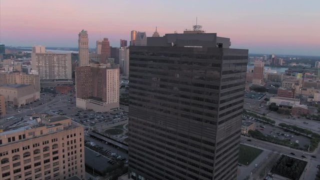 Aerial: Downtown Detroit buildings at sunset. Detroit, Michigan, USA