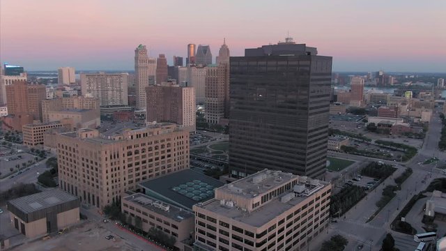 Aerial: Downtown Detroit buildings at sunset. Detroit, Michigan, USA