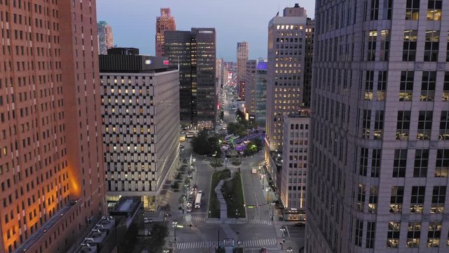 Aerial: Detroit city skyline and traffic at night. Detroit, Michigan, USA.