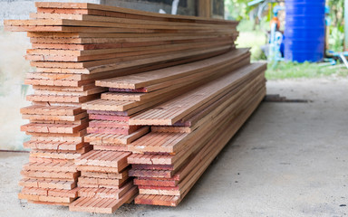 Stack stock of edging red meranti wood lumber board for building swallows nest.