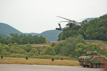 Fototapeta na wymiar military helicopter is hoverring
