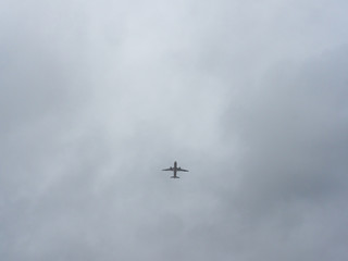 Fototapeta na wymiar passenger jet silhouette against a cloudy sky
