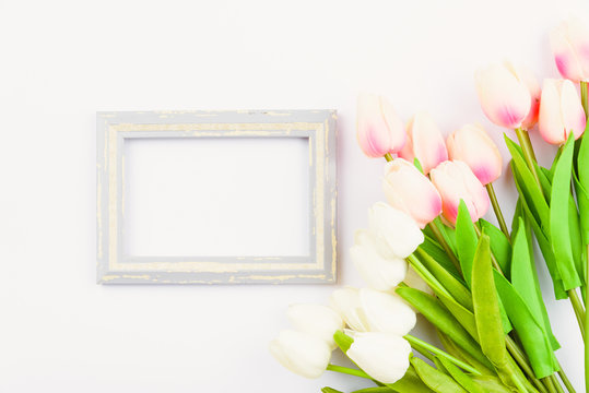 Happy Women's Day, Mother's Day and Valentine's Day concept. top view flat lay Tulip flower and photo frame