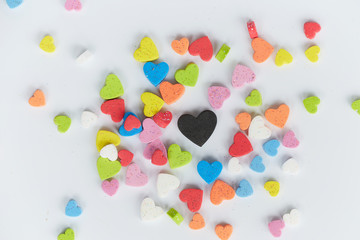 Colorful of hearts shaped foam on white background. Minimal Love concept. Top view. Flat lay.