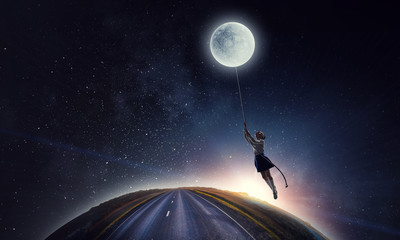 Obraz na płótnie Canvas Girl holds the moon . Mixed media