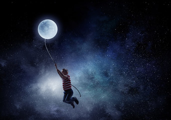 Fototapeta na wymiar Kid boy catching moon. Mixed media