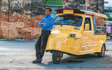 Tuk Tuk car tourist at parking outdoor at old temple background, Tuk Tuk is taxi car for travel around the Ayutthaya Province, Thailand