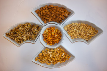 Mixed nuts in a snack tray for a party