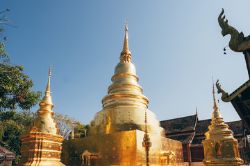 Fototapeta premium Golden stupa in Wat Phra Singh temple in Chiang Mai, Thailand.