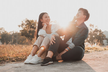 Attractive young asian women LGBT lesbian couple moments romantic and happiness with lens flare.