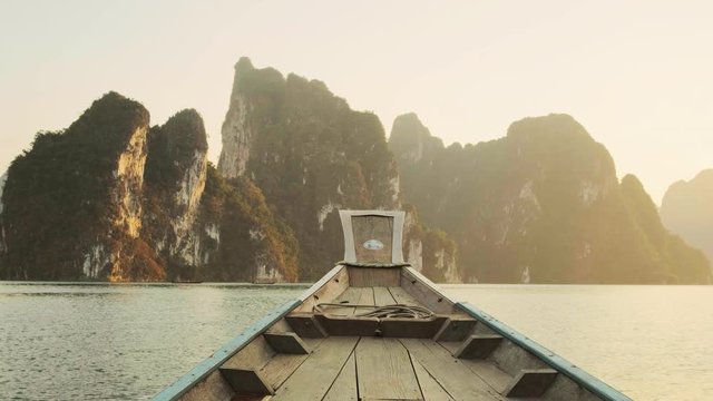 Wooden traditional longtail boat on Cheow Lan lake in Khao Sok National Park