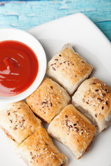 Vegan sausage rolls with tomato sauce