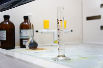 The measuring cylinder is placed in the fume hood of the chemical laboratory.