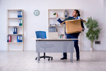 Young employee being made redundant