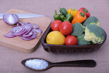 vegetables in a cup, spices and a spoonful of salt