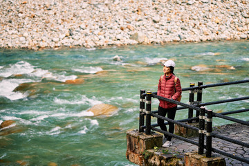 Asian woman is looking view in Kurobe gorge, Toyama, Japan