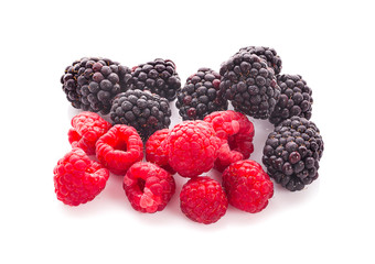 blackberries with raspberries and green leaf isolated on white background