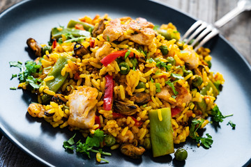 Paella seafood on wooden background