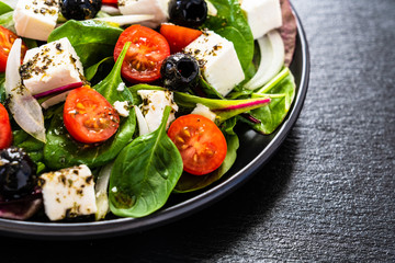 Fresh greek salad - feta cheese, tomato, lettuce, black olives and onion