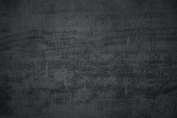 Black concrete textured wall background.black cement wall texture for interior design. dark edges.copy space for add text.