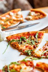 friends eating pizza in the cafe