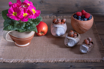 hazelnuts on a table with sprinkled berries