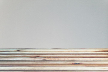wood table top with gray concrete wall background. Used for product placement or montage.