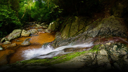 The waterfall in the forest with soft light © arnuphapy