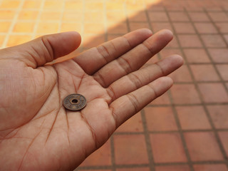 hand with ancient coin