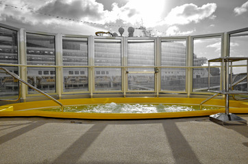 Big whirlpool on outdoor deck on modern cruiseship liner or cruise ship vessel with oceanview or...