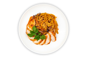 Pan asian food. Wok noodles on a white plate, top view. White isolated background