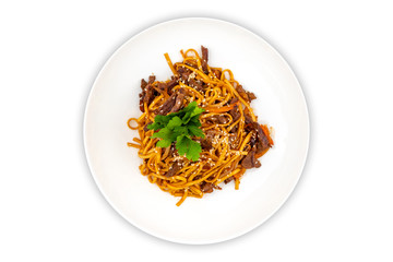 Pan asian food. Wok noodles on a white plate, top view. White isolated background